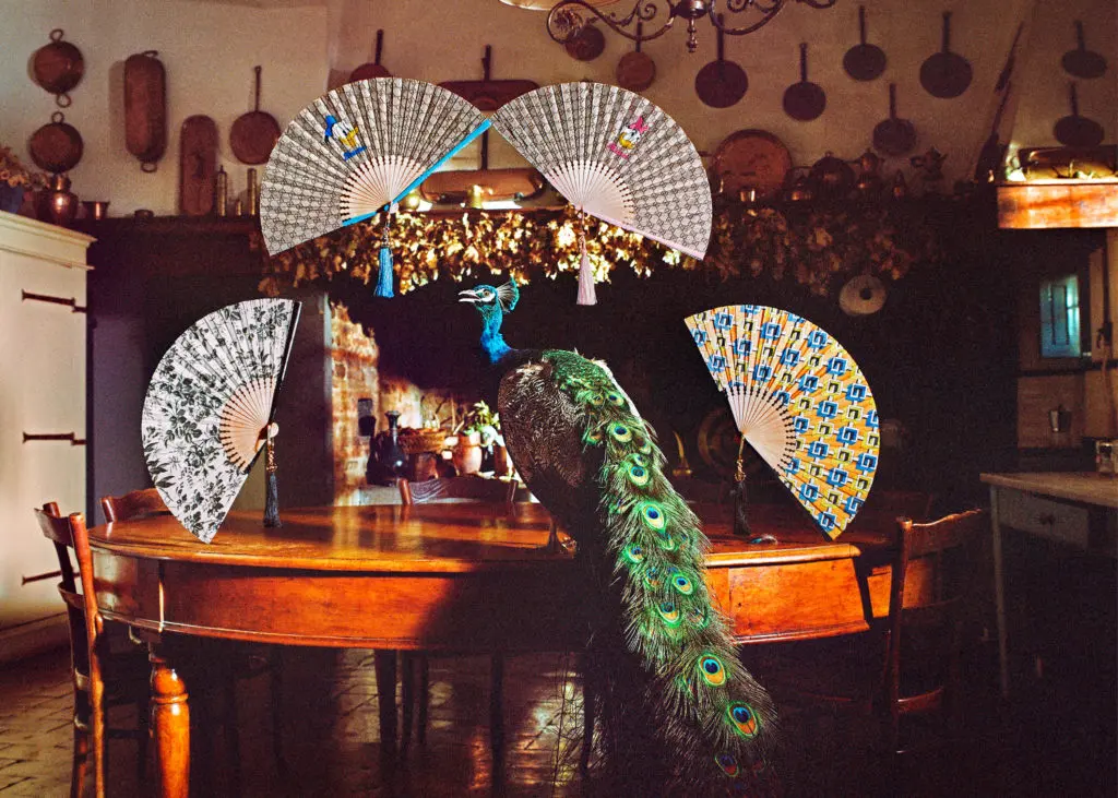 The inventive Gucci Lifestyle collection includes dramatically printed fans made of wood and satin, priced from $750. 