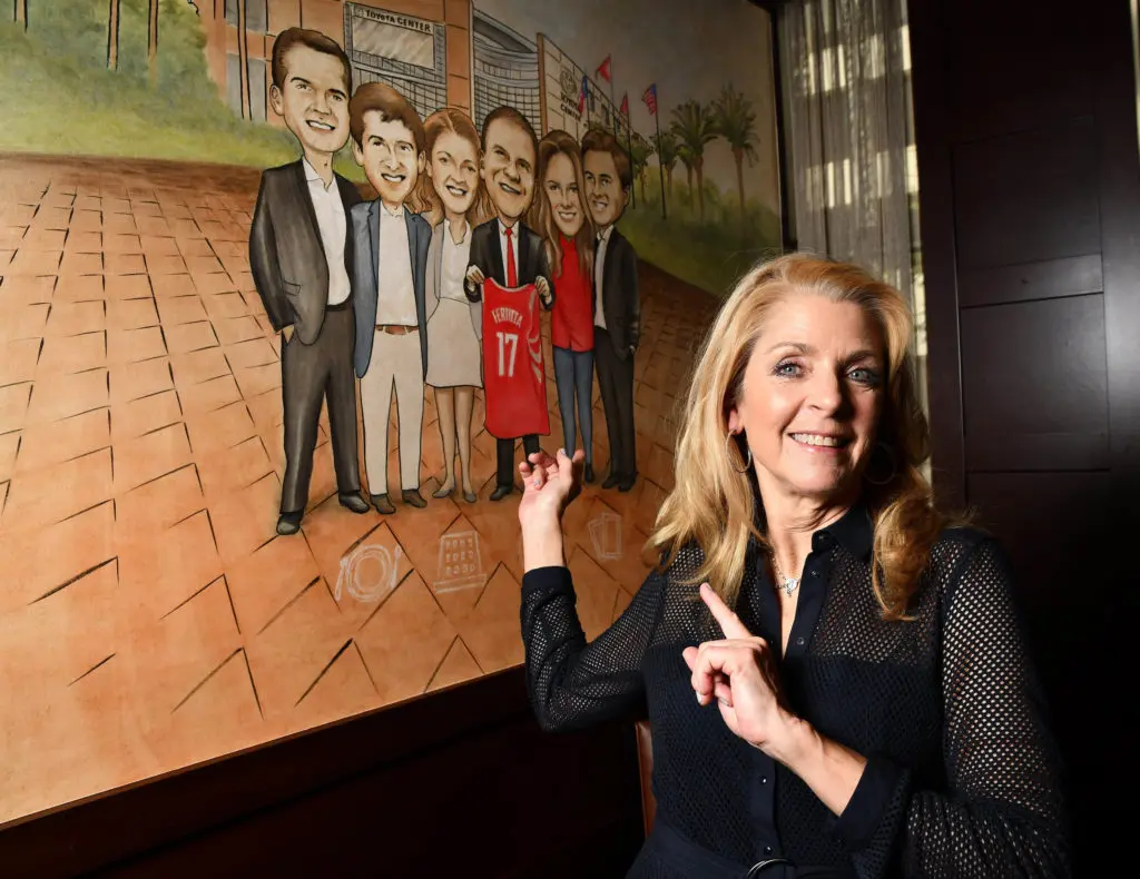 Paige Fertitta in front of a family mural in one of the dining rooms at the new Palm Restaurant downtown. (Dave Rossman photo) (Photo by Shelby Hodge)