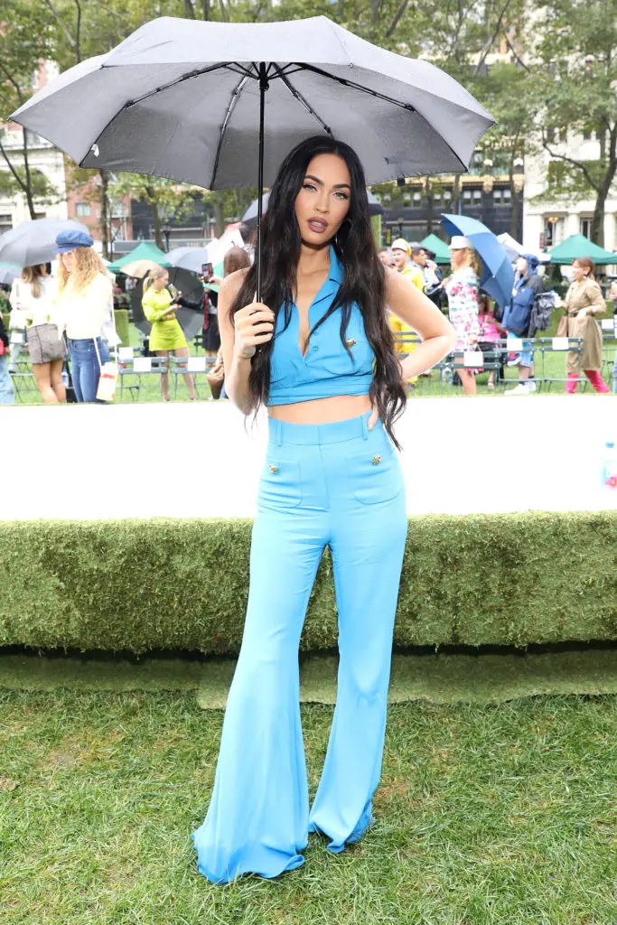 Megan Fox was among the celebrities attending the Moschino runway show in the rain (Photo by Monica Schipper/Getty Images  for Moschino))