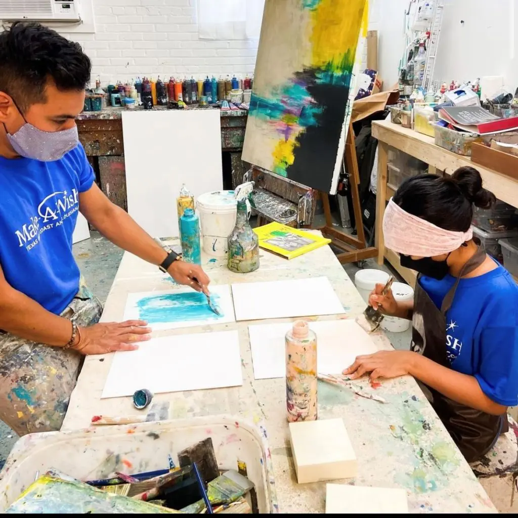 In the lab with Edgar Medina and 10-year-old cancer survivor Melinda Moreno, at work on their "Moments Through Seasons" series on view at Laura Rathe Fine Art.