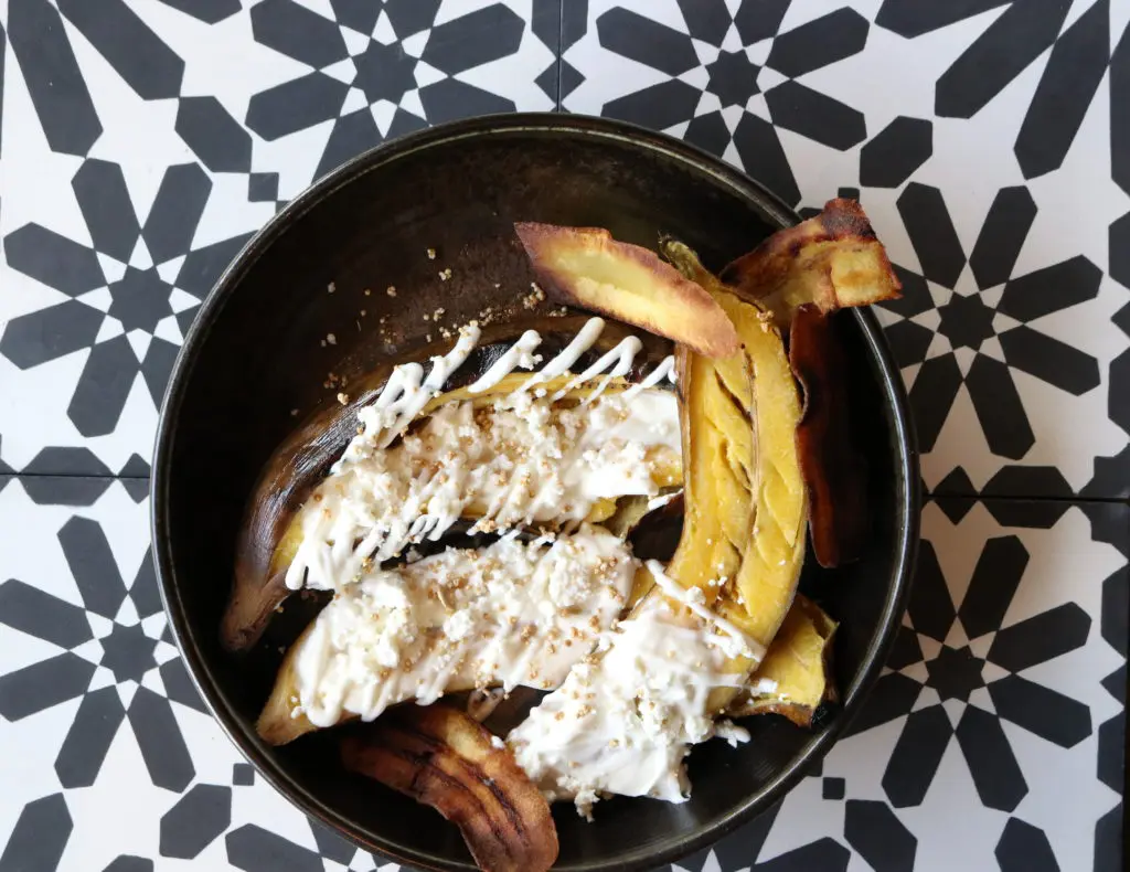 Urbe's platanos rostizados is an oven-roasted plantain with creme dulce and quest fresco topped with crispy plantain chips. (Photo by Paula Murphy)