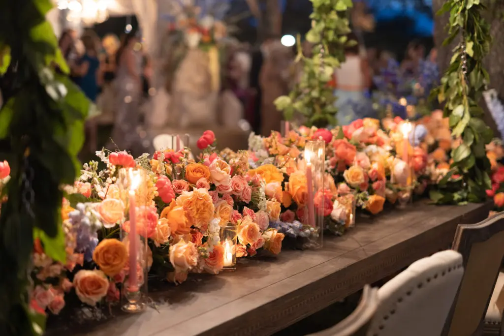 Trees were wrapped in flowers with tables suspended from the branches. (Photo by Sterling Steves for Sterling FX)