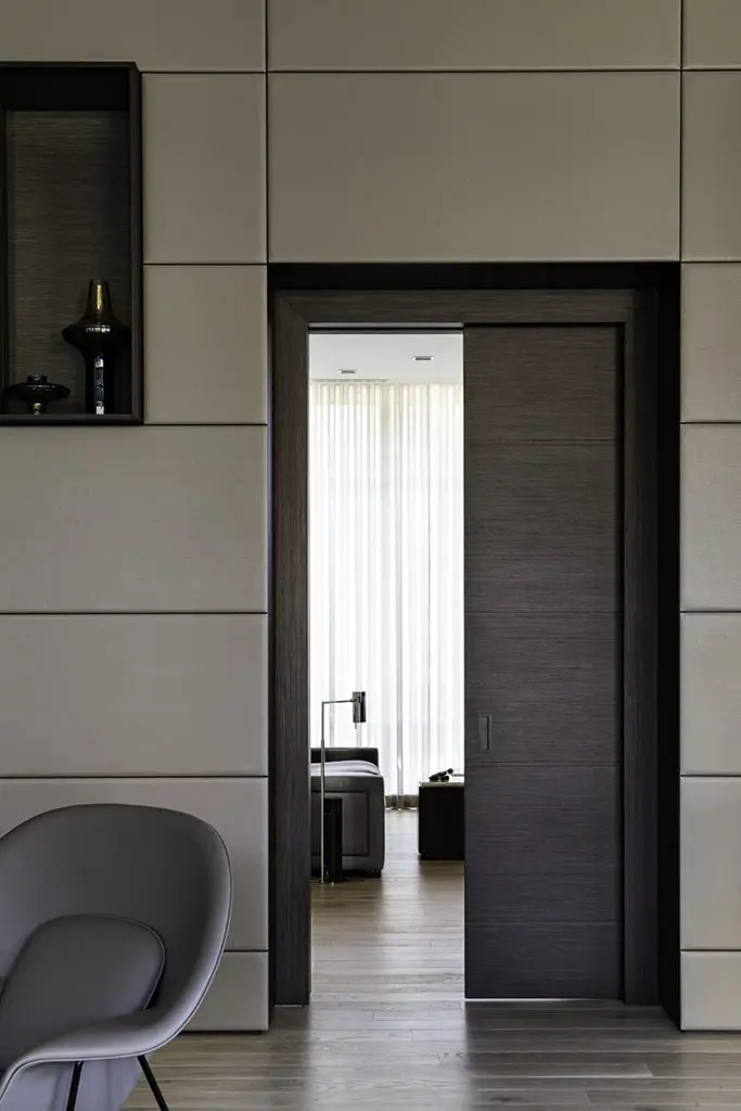 A concealed pocket door maximizes function while remaining sleek and understated.  (Photo by Manny Rodriguez)