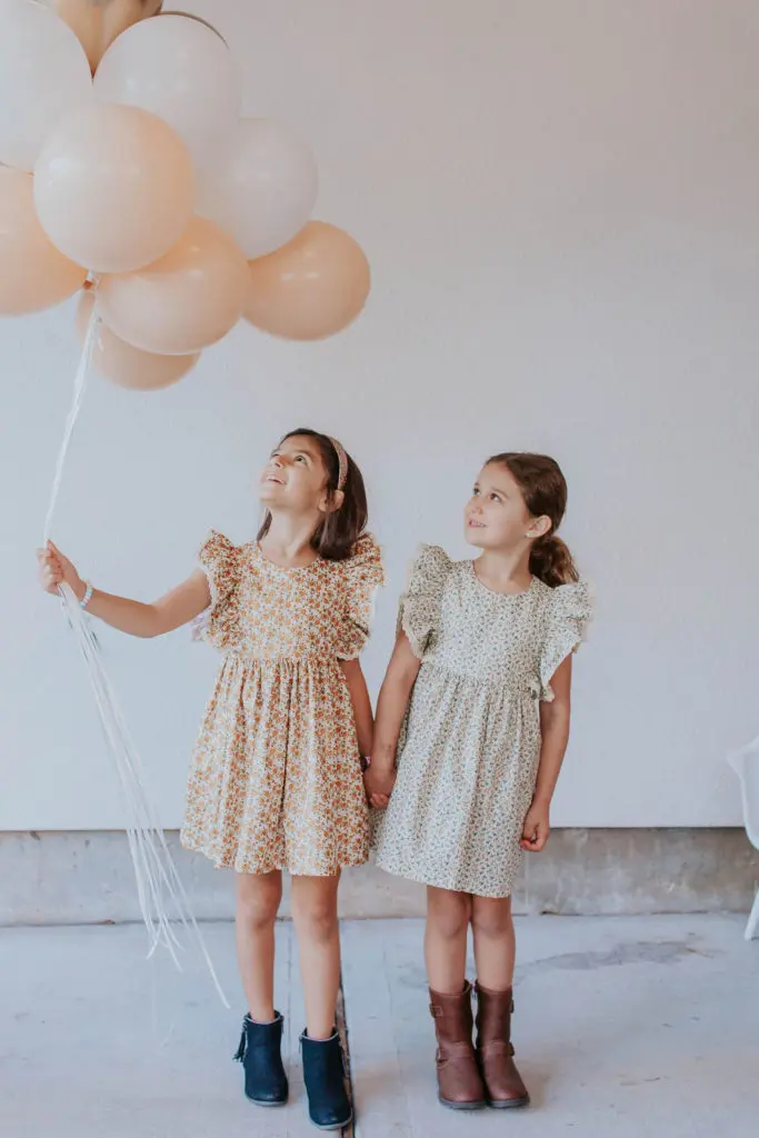 Cuteheads' vintage inspired pinafore ruffle dress with crochet lace trim.