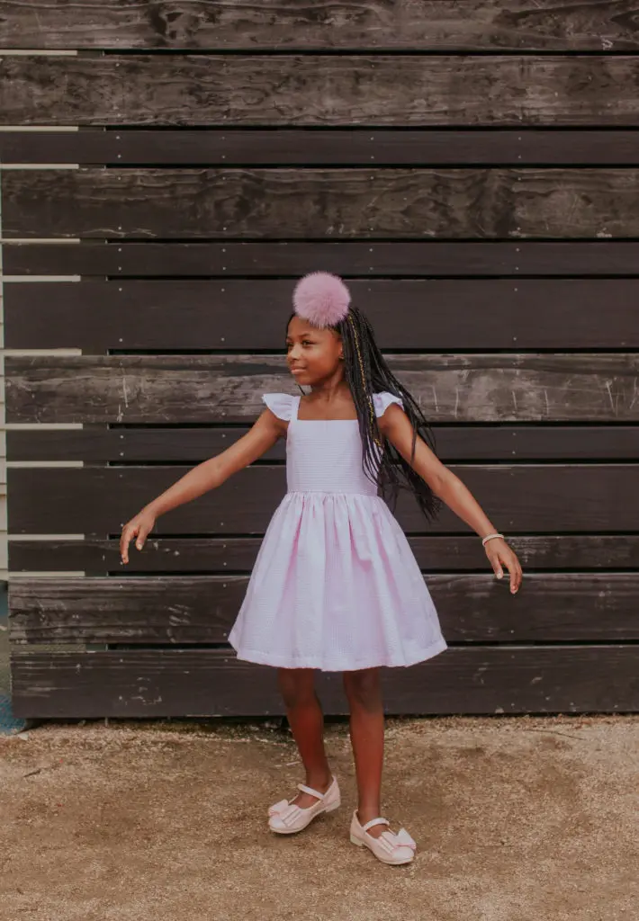 The pink and white seersucker flutter sleeve sun dress by cuteheads.
