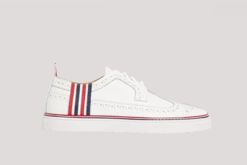 Thom Browne white pebbled 4-bar brogue sneaker, $750, available at Thombrowne.com