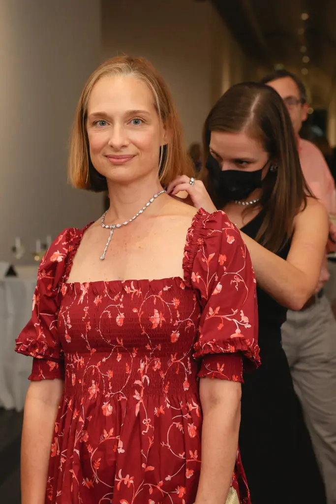 Dana Duterroil trying on diamonds at the De Beers Jewellers celebration of its Reflections of Nature collection at The Menil Collection. (Photo by Johnny Than)