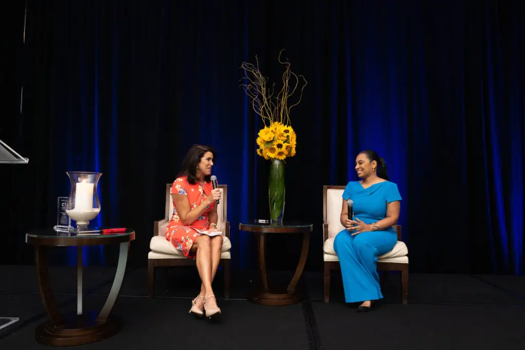 Lisa Malosky interviews cancer survivor Shawntell McWilliams at the CanCare 30th anniversary luncheon at the Westin Memorial City. (Photo by Daniel Ortiz)