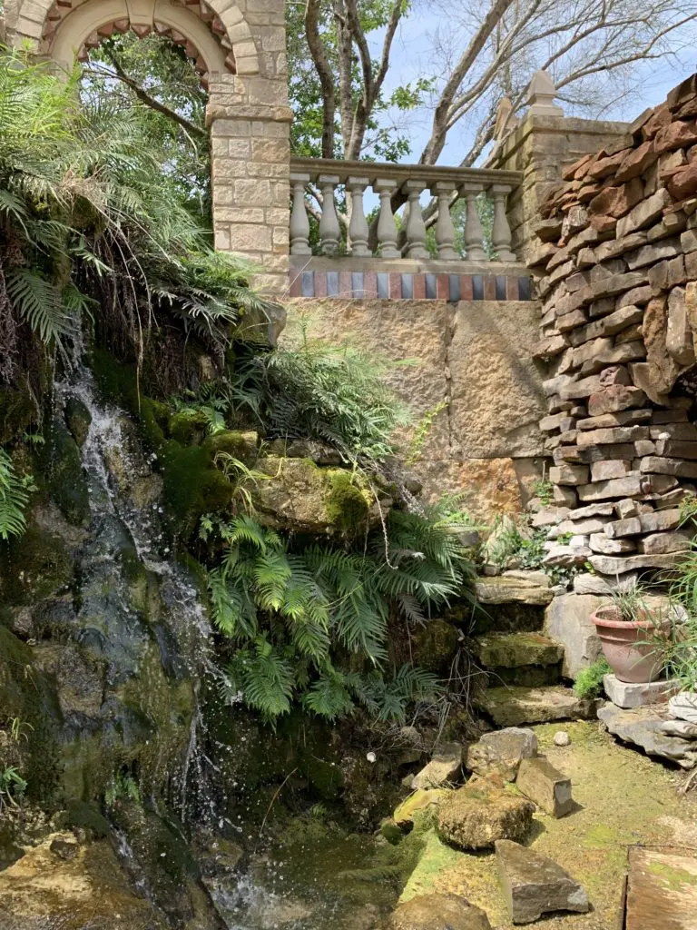 A vignette from Round Top Festival Institute's renowned gardens, where a brook, plantings, and old stone walls, are translated into Benjamin Moore's The Colors of Round Top Collection. 