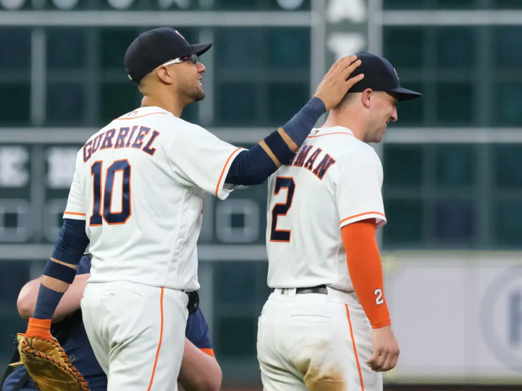 Yuli Gurriel is always ready to give Alex Bregman some love. (Photo by F. Carter Smith)