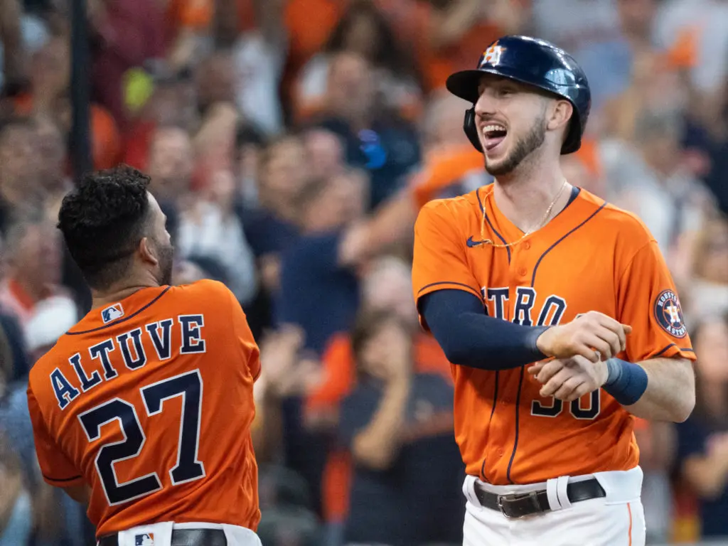 Jose Altuve and Kyle Tucker know how to celebrate big October moments. (Photo by F. Carter Smith)