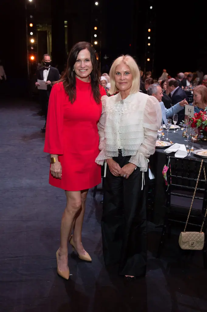 Cabrina Owsley, Kelli Blanton at the Margaret Alkek Williams 'Jubilee of Dance' on-stage dinner.  (Photo by Wilson Parish)