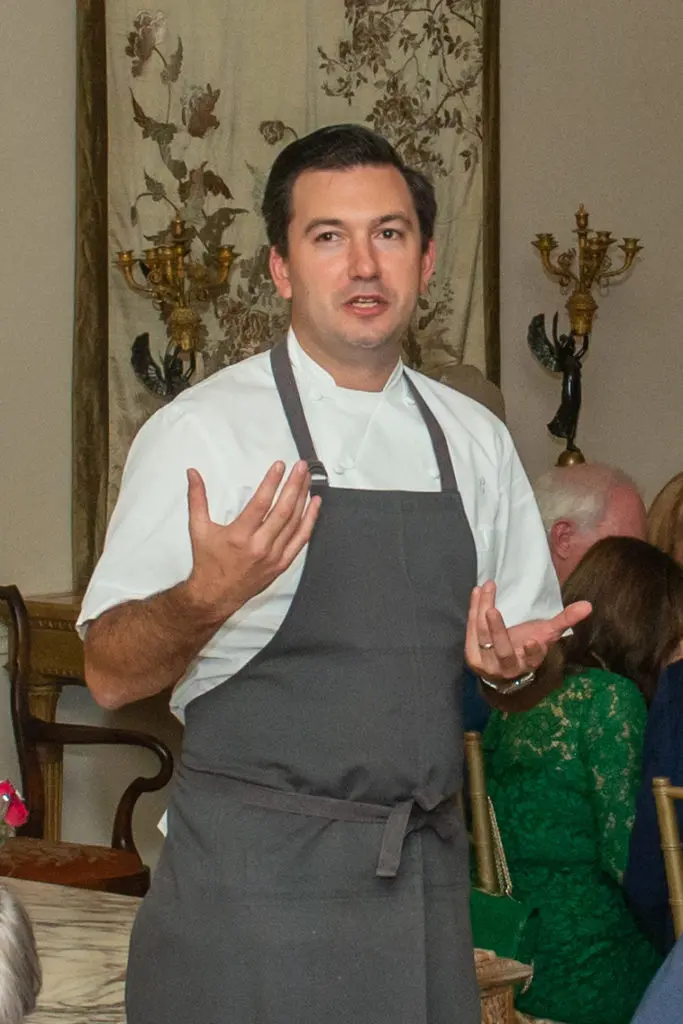 Chef Aaron Bludorn explains the four-course menu that he created for The American Hospital of Paris Foundation dinner. (Photo by Jacob Power)