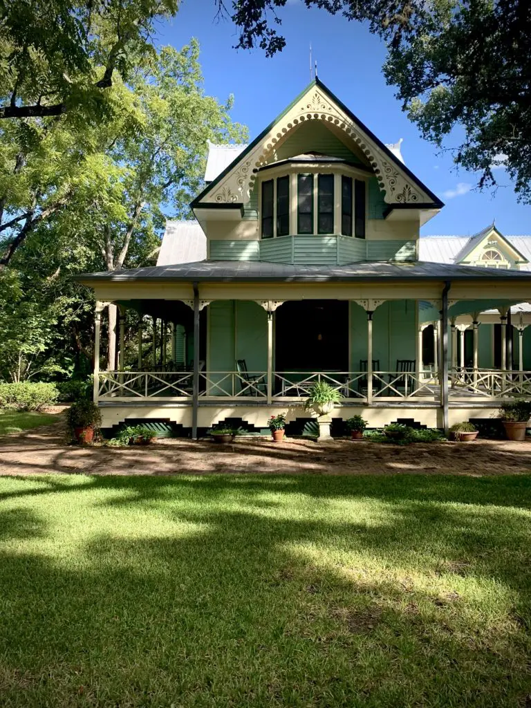 The William Lockhart Clayton House, named in honor of the man who authored World War II's Marshall Plan for Europe's recovery, is a classic Victorian that was preserved and moved in 1976 to Festival Institute. Its calm green-and-cream gingerbread exterior provided one of the palettes for The Colors of Round Top from Benjamin Moore.  
