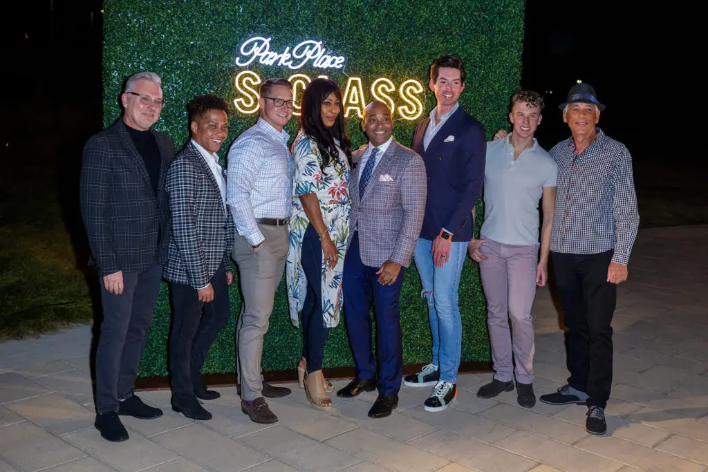 Park Place Arlington's Malcolm Gage poses with his guests at the launch party.
