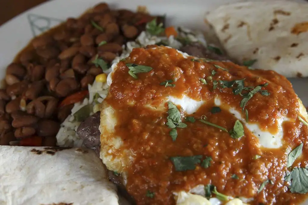 Cowboy cooking like Huevos Rancheros at Reata. 