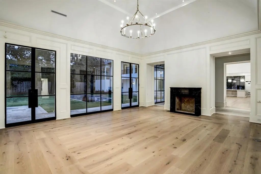 The formal living room at 3001 Inverness features a 17 foot vaulted ceiling. (Photo by TK Images)