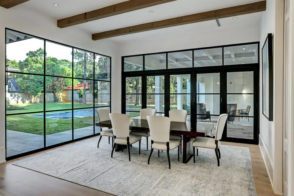 The light filled breakfast room fully opens to the summer kitchen and loggia. (Photo by TK Images)