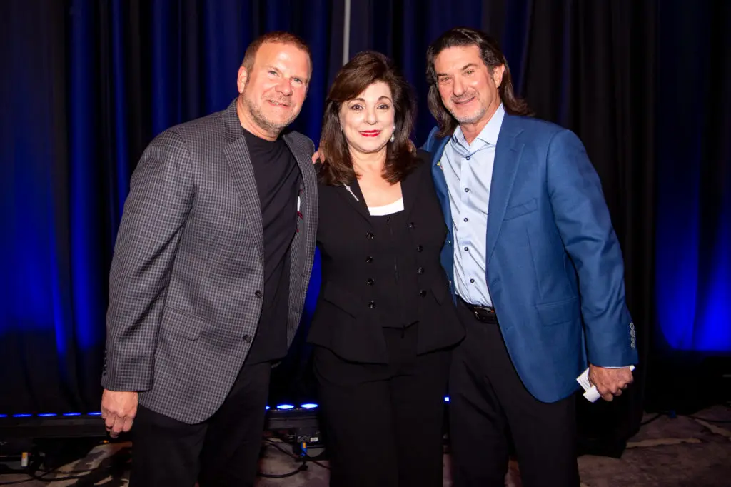 Tilman Fertitta, Laura Ward, Gary Becker at the Houston Children's Charity 25th anniversary luncheon. (Photo by Michelle Watson, catchlightgroup.com)