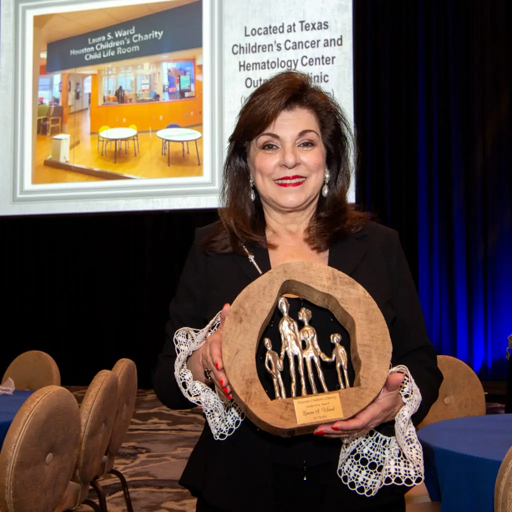Houston Children's Charity CEO Laura Ward with her Leadership Award and 