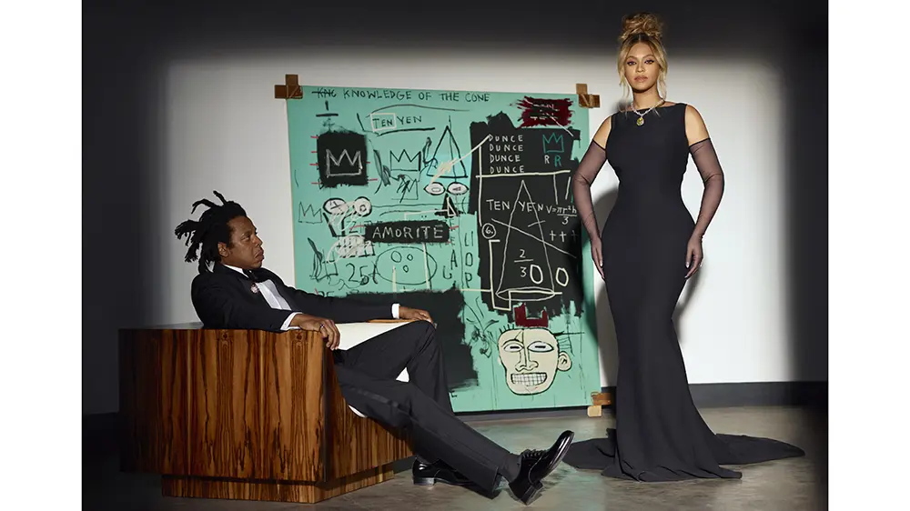 Jay Z & Beyoncé in the 'About Love' ad campaign from Tiffany & Co./The Estate of Jean-Michel Basquiat/Licensed by Artestar, New York. The same painting is an element of the Tiffany & Co. Advent calendar.