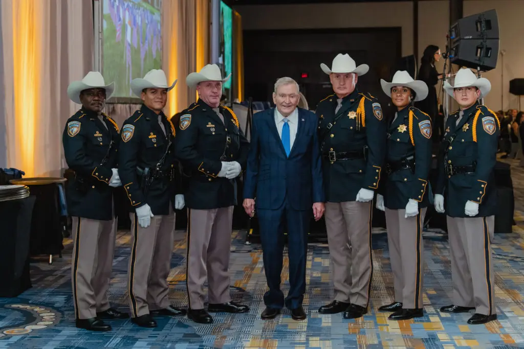 Houston media icon and honoree Dave Ward with Harris County Sheriff's Office Honor Guard at the Crime Stoppers of Houston gala (Photo by CatchlightGroup.com)
