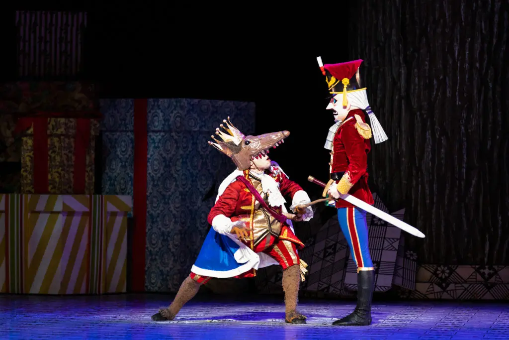Houston Ballet Corps de Ballet dancer Simone Acri as the Rat King and Demi Soloist Chandler Dalton as the Nutcracker in the 2021 season opener of Stanton Welch’s The Nutcracker. (Photo by Lawrence Elizabeth Knox, Courtesy of Houston Ballet.)
