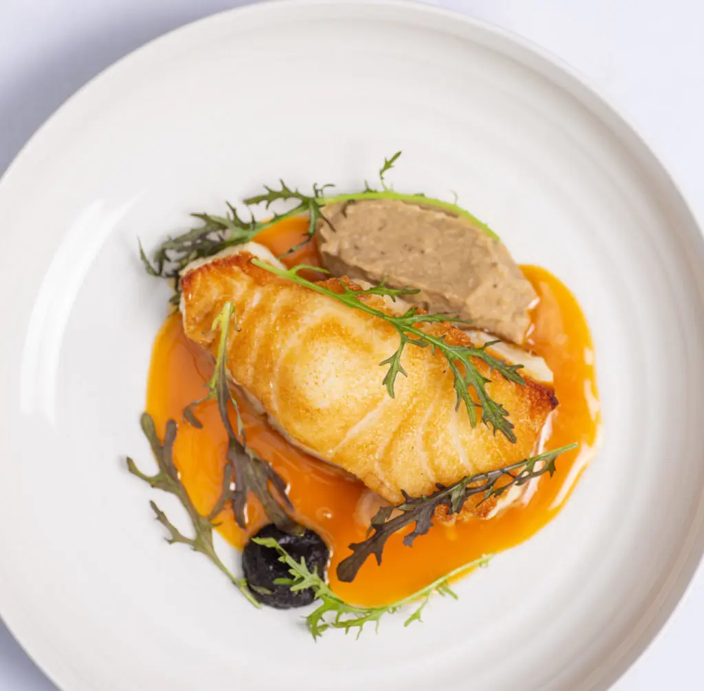 The pan seared sea bass at Villa Azur Dallas is a favorite. 