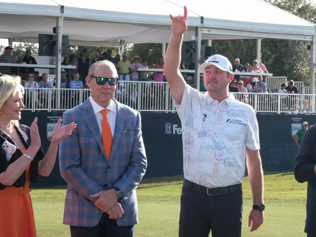 Whitney Crane, Jim Crane and Jason Kokrak  enjoy the moment after a successful Houston Open. (Photo by F. Carter Smith)
