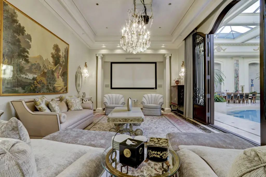 One of several sitting areas in the 2115 River Oaks Boulevard home that open to the vast air-conditioned pool room. (Photo by TK Images)