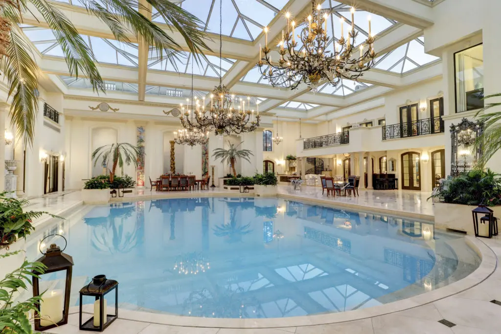 The 12,000 square foot pool room in the former home of the late Baron Ricky di Portanova is enclosed in 70 tons of glass and steel. (Photo by TK Images)