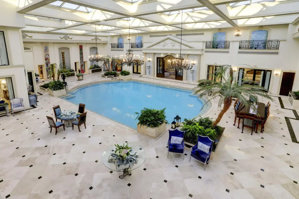 The 12,000 square foot pool room in the former home of the late Baron Ricky di Portanova is enclosed in 70 tons of glass and steel. (Photo by TK Images)