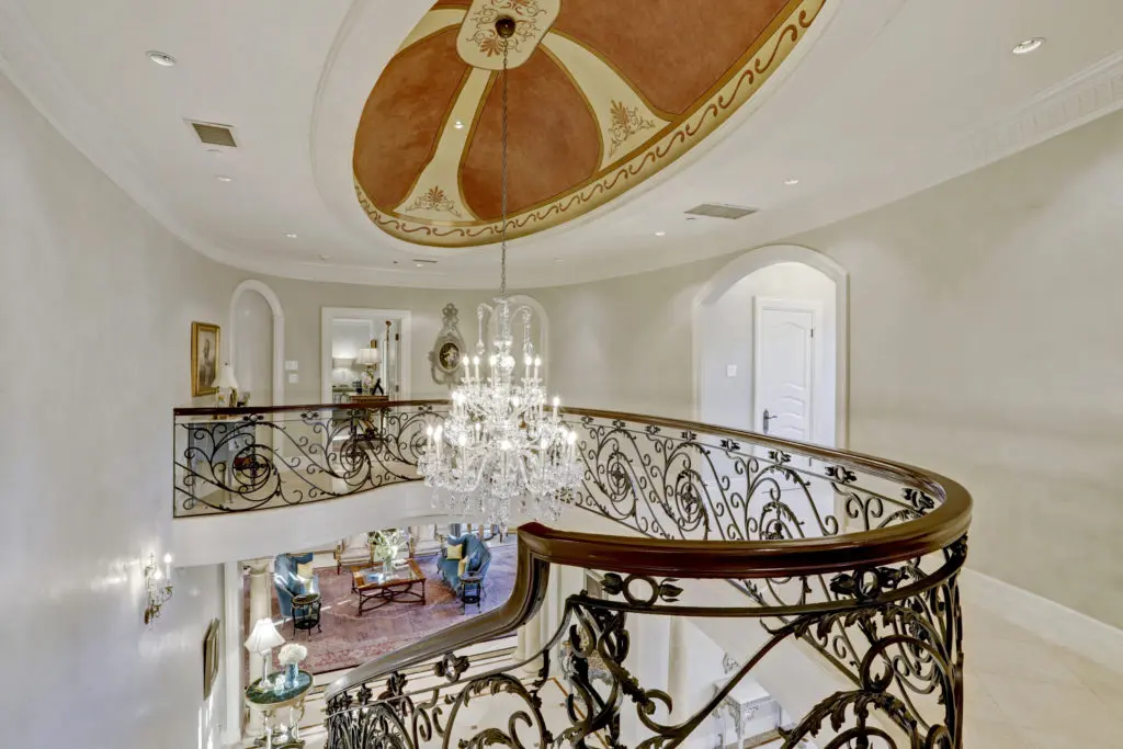 Arched doorways lead to the second-floor bedrooms in the home at 2115 River Oaks Boulevard. (Photo by TK Images)