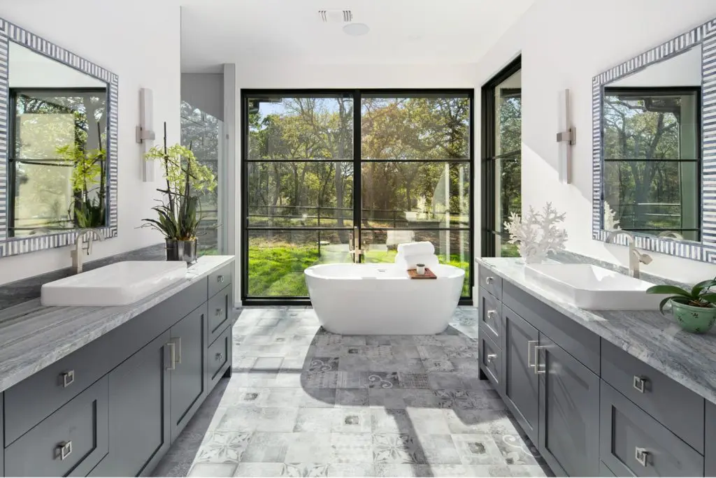 Soaker tub takes center stage in the primary suite. Photos courtesy of Zach Spross, for Douglas Elliman.