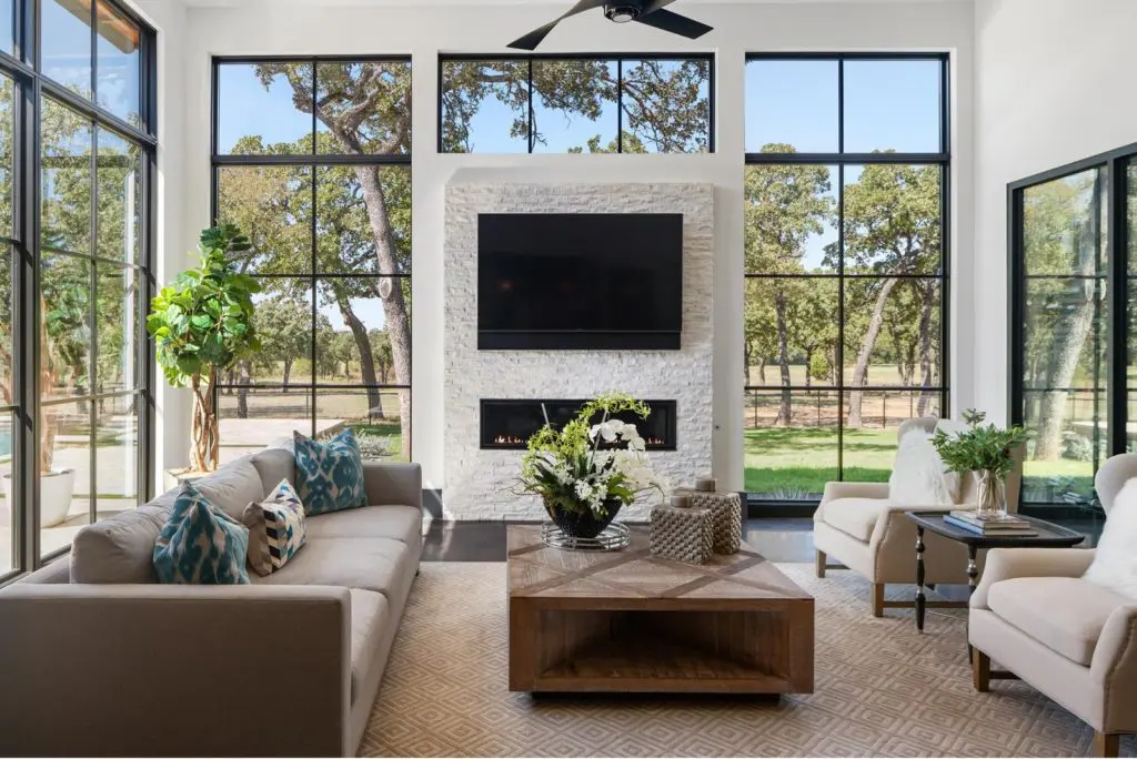 1200 Rockgate Road boasts three-sided walls of glass bringing the outside into the great room. Photos courtesy of Zach Spross, for Douglas Elliman.