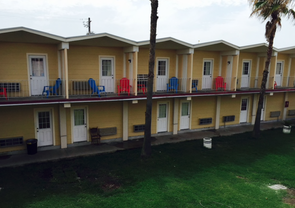 The garish yellow facade of the now-closed Pearl Inn will be reimagined in serene colorations suggested by white brick and bleached white oak.
