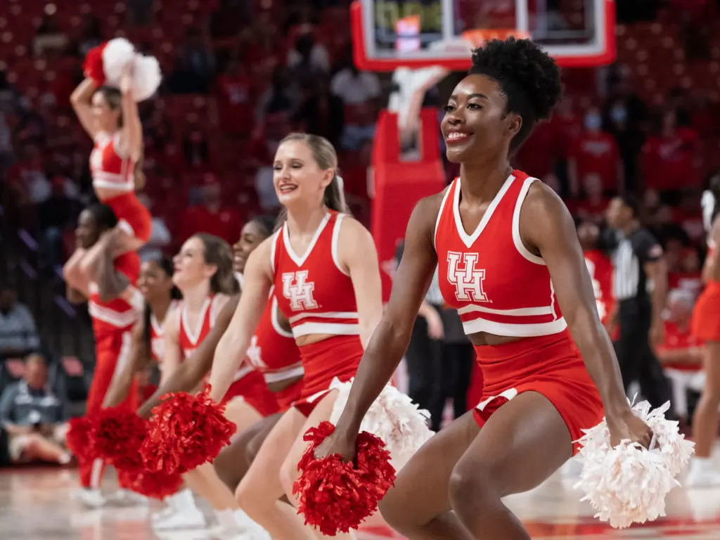 University of Houston's cheerleaders bring plenty to the Fertitta Center party. (Photo by F. Carter Smith)