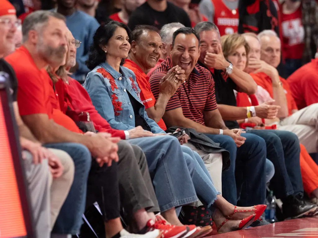 University of Houston president Renu Khator and her husband Suresh are front row regulars for UH basketball. Photo by F. Carter Smith)