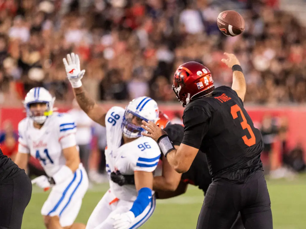 Clayton Tune is never afraid to take a hit to throw a pass for UH. (Photo by F. Carter Smith)