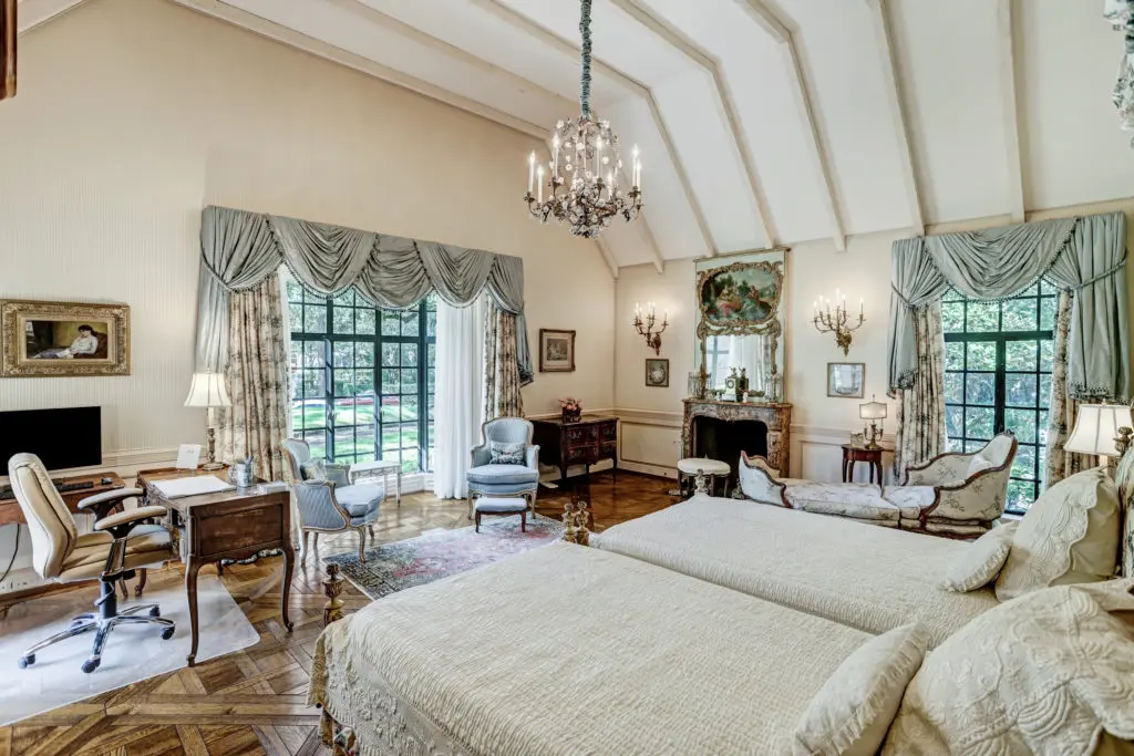 The primary bedroom on the ground floor features a parlor and two separate baths. (Photo by TK Images)
