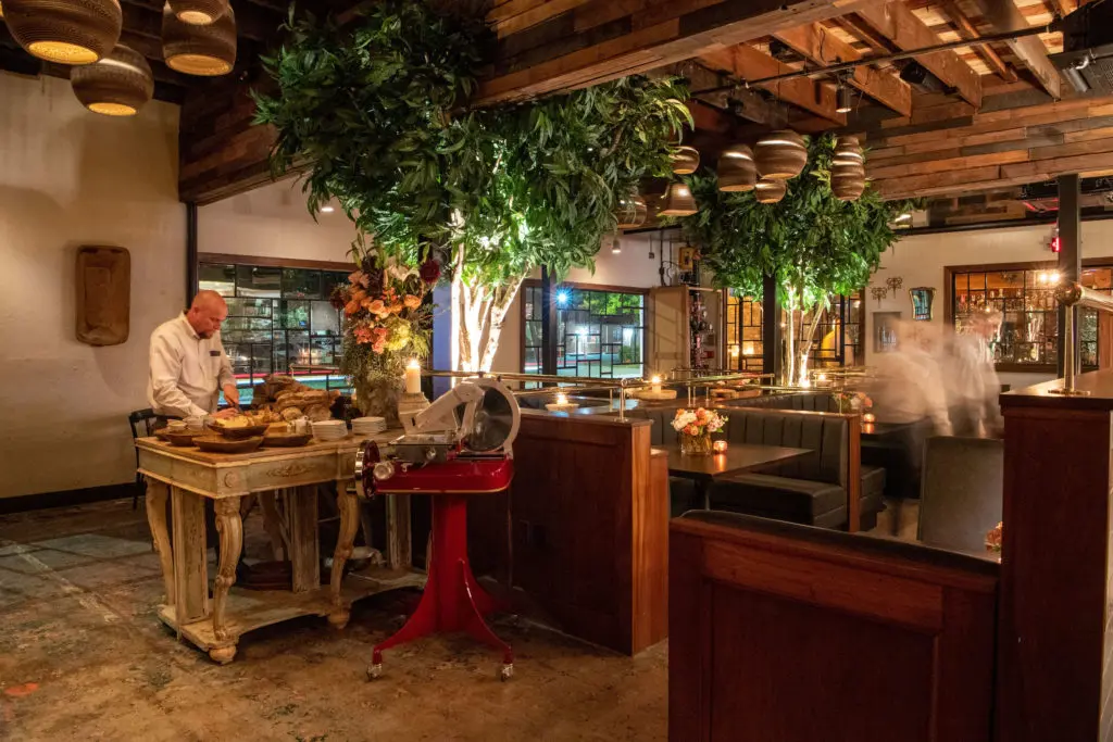 Walk into the dining room at Trattoria Sofia, and you'll find a gleaming red Berkel Slicer and bread station, featuring house made loafs made daily. (Photo Michelle Watson)