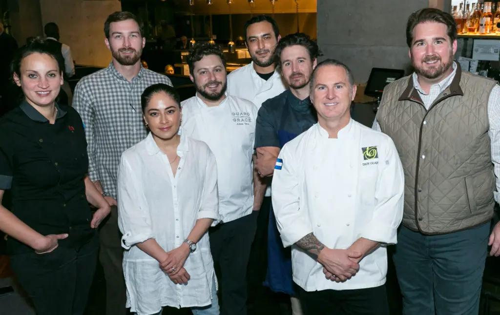 Chefs and chef teams working the Urban Harvest Sunday Supper include Kate McLean, far left; second from left Troy Guard; and Drake Leonards, far right. (Photo by Emily Jaschke)