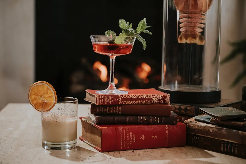 Grab a classic holiday cocktail in one of the mansions lovely sitting rooms. (Photo by Auberge Resorts Collection)
