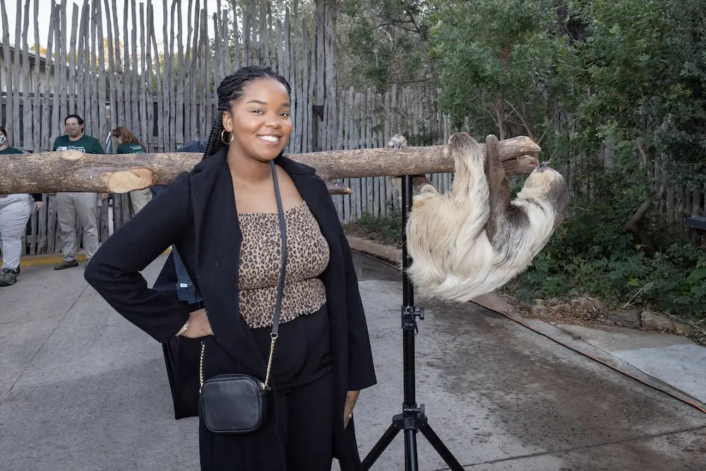 Lauren Dillard with a sloth at the 30th anniversary of Zoo to Do in Dallas. (Photo by Thomas Garza Photography)