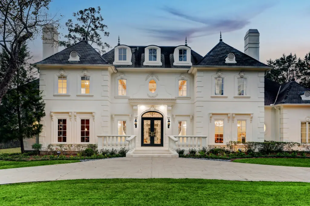 This 9,871 square foot French chateau-style mansion in Piney Point hits the market for $4,195,000. Compass' Sabiha Rehmatulla has the listing. (Photo by TK Images)