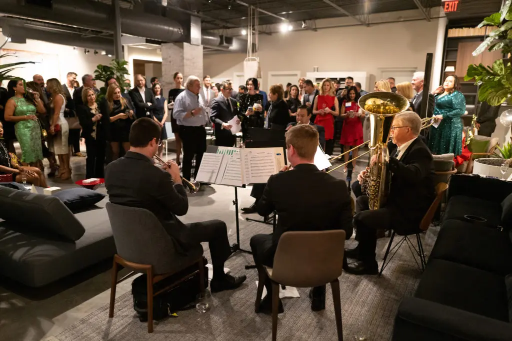 Brass musicians from the Houston Symphony perform at the Young Associates Council holiday party at BeDESIGN. (Photo by Daniel Ortiz)