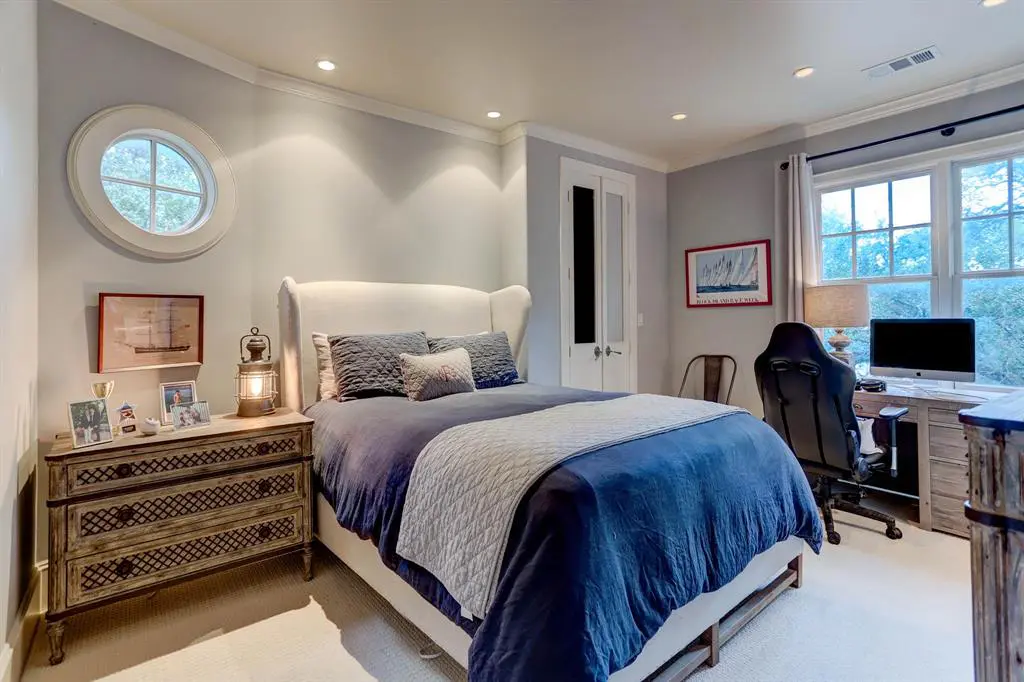 One of four secondary bedrooms in the home at 1821 Sharp Place in River Oaks.  (Photo by TK Images)