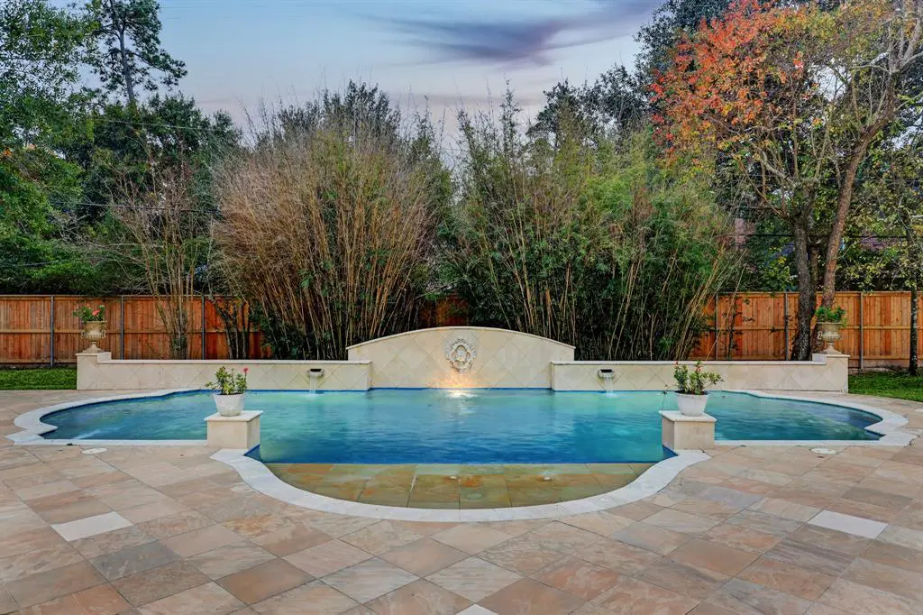 The swimming pool at 6 Pine Tree Lane is a stunner. (Photo by TK Images)
