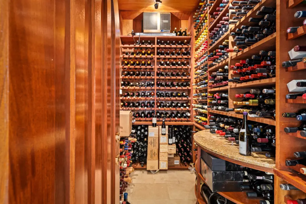 This Kirby Drive home features a 2,000+ bottle wine vault.