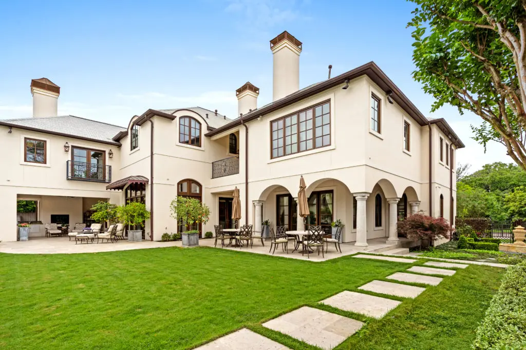 As you venture outside of this elegant River Oaks estate, you'll find a tree-lined pool, fountain, raised vegetable and herb gardens, and covered walkways.